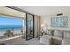 Inviting living room with balcony access, showcasing beautiful ocean view and comfortable seating at 2675 Gulf Of Mexico Dr # 301, Longboat Key, FL 34228