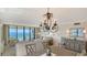 Bright living space featuring stylish chandelier and ocean views, with a cozy and welcoming atmosphere at 2675 Gulf Of Mexico Dr # 301, Longboat Key, FL 34228