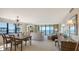Open-concept living and dining area with ocean views and stylish, comfortable furnishings at 2675 Gulf Of Mexico Dr # 301, Longboat Key, FL 34228