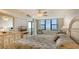 Relaxing main bedroom with a serene ocean view and access to a private balcony at 2675 Gulf Of Mexico Dr # 301, Longboat Key, FL 34228