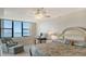 Bright main bedroom with beautiful ocean view from the large window at 2675 Gulf Of Mexico Dr # 301, Longboat Key, FL 34228