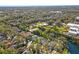 Expansive aerial view of the community, showing the neighborhood layout, landscaping, and surrounding environment at 28 Tall Trees Ct, Sarasota, FL 34232