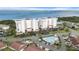 Aerial view of condo buildings, outdoor pool, and lake at 2825 Terra Ceia Bay Blvd # 1505, Palmetto, FL 34221