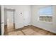 Bright bedroom with wood floors, white walls, and a view from the window at 2825 Terra Ceia Bay Blvd # 1505, Palmetto, FL 34221