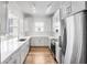 Beautiful kitchen featuring bright white cabinets, stainless appliances and long countertops at 2825 Terra Ceia Bay Blvd # 1505, Palmetto, FL 34221