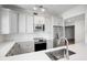 Modern kitchen featuring white quartz countertops and stainless steel appliances at 2825 Terra Ceia Bay Blvd # 1505, Palmetto, FL 34221