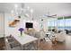 Bright living room featuring hardwood floors, stylish furnishings, and expansive water views at 2825 Terra Ceia Bay Blvd # 1505, Palmetto, FL 34221