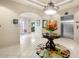 Well-lit lobby with floral arrangement, elevator, and glass doors at 2825 Terra Ceia Bay Blvd # 1505, Palmetto, FL 34221