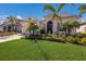 Inviting home with a well-kept lawn, lovely landscaping, and a convenient two-car garage at 3605 Wild Blossom Pl, Parrish, FL 34219