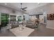 Bright living space combining the living and kitchen areas with modern decor and natural light at 3605 Wild Blossom Pl, Parrish, FL 34219