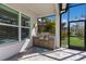 Outdoor kitchen featuring stainless steel grill, granite countertops, and stylish cabinets for outdoor dining at 3605 Wild Blossom Pl, Parrish, FL 34219