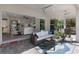 Comfortable patio with sliding glass doors to the house and a cozy seating area with an outdoor grill at 3605 Wild Blossom Pl, Parrish, FL 34219