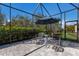 Charming patio with comfortable seating, perfect for enjoying the outdoors within a screened enclosure at 3605 Wild Blossom Pl, Parrish, FL 34219