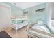 bedroom with two beds, light blue walls and whale art at 418 Magnolia Ave, Anna Maria, FL 34216