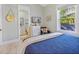 Comfortable bedroom with dresser, television, and attached bathroom at 418 Magnolia Ave, Anna Maria, FL 34216