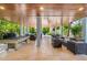 Beautiful outdoor recreation area featuring a pool table and multiple seating areas at 418 Magnolia Ave, Anna Maria, FL 34216