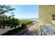 Enjoy the Gulf views from this condo balcony with path to beach and lush landscaping at 4200 Gulf Dr # 101, Holmes Beach, FL 34217