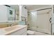 Bathroom featuring tile backsplash, extended countertop, and a shower with tub at 4200 Gulf Dr # 101, Holmes Beach, FL 34217