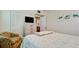 Bedroom with seating area and view into another bedroom at 4200 Gulf Dr # 101, Holmes Beach, FL 34217