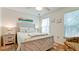 Coastal bedroom with modern coastal decor and lots of natural light at 4200 Gulf Dr # 101, Holmes Beach, FL 34217