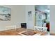 Bright dining area with a wooden table adjacent to the kitchen at 4200 Gulf Dr # 101, Holmes Beach, FL 34217
