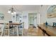 Open hallway leading to the dining area with tile flooring at 4200 Gulf Dr # 101, Holmes Beach, FL 34217