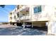 Covered parking area offering convenient parking and storage at 4200 Gulf Dr # 101, Holmes Beach, FL 34217