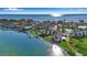 Aerial view of the coastal condos with boat docks and beach access, offering a luxurious waterfront lifestyle at 4234 Gulf Of Mexico Dr # H2, Longboat Key, FL 34228