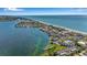 Expansive aerial view of coastal condos, blending waterfront living with beach access and community amenities at 4234 Gulf Of Mexico Dr # H2, Longboat Key, FL 34228