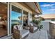 Relax on this tiled balcony with wicker furniture and plush pillows, offering peaceful views of the outdoors at 4234 Gulf Of Mexico Dr # H2, Longboat Key, FL 34228