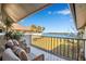 Enjoy stunning water views from this lovely tiled balcony with comfortable seating and relaxing decor at 4234 Gulf Of Mexico Dr # H2, Longboat Key, FL 34228