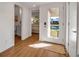 Welcoming foyer with wood flooring, leading to a bedroom, bathroom and outdoor view at 4234 Gulf Of Mexico Dr # H2, Longboat Key, FL 34228