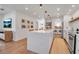 Spacious kitchen with a large waterfall island, stainless steel appliances, and an open layout at 4234 Gulf Of Mexico Dr # H2, Longboat Key, FL 34228