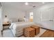Bright main bedroom with neutral tones, hardwood floors, and ensuite access at 4234 Gulf Of Mexico Dr # H2, Longboat Key, FL 34228