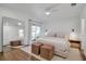 Bright main bedroom with neutral tones, walk-out balcony and hardwood floors at 4234 Gulf Of Mexico Dr # H2, Longboat Key, FL 34228