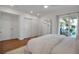 Bright main bedroom with neutral tones, large closets and walk-out balcony at 4234 Gulf Of Mexico Dr # H2, Longboat Key, FL 34228