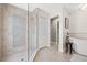 Bright bathroom with a glass-enclosed shower, standalone tub, and closet view at 4477 White Cedar Trl, Sarasota, FL 34238