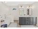 Elegant bathroom featuring double vanity, modern fixtures, and a freestanding bathtub at 4477 White Cedar Trl, Sarasota, FL 34238