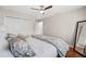 Comfortable bedroom with a closet, large bed, and full-length mirror, designed for relaxation and style at 4477 White Cedar Trl, Sarasota, FL 34238