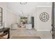 The living room is bright and airy with neutral tones, tile floors, and a view of the backyard at 4477 White Cedar Trl, Sarasota, FL 34238