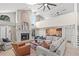 Spacious living room with a fireplace, vaulted ceilings, and a wet bar, creating an inviting atmosphere at 4477 White Cedar Trl, Sarasota, FL 34238