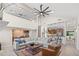 Bright and airy living room with a wet bar, soaring ceilings, and an open layout to the kitchen at 4477 White Cedar Trl, Sarasota, FL 34238