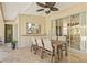 Inviting outdoor dining area on the lanai, providing an ideal space for al fresco meals and gatherings at 4477 White Cedar Trl, Sarasota, FL 34238