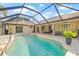 Beautiful screened-in pool and patio area, perfect for outdoor entertaining and relaxation at 4477 White Cedar Trl, Sarasota, FL 34238