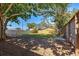 Large, fenced backyard with mature trees providing shade and privacy at 470 Leach St, Englewood, FL 34223