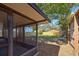 View of a fenced backyard from the screened-in patio, showcasing the outdoor space at 470 Leach St, Englewood, FL 34223