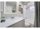 A clean bathroom featuring a modern vanity, toilet and shower at 470 Leach St, Englewood, FL 34223