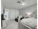 Cozy bedroom featuring a chaise lounge, neutral carpeting, and closet at 470 Leach St, Englewood, FL 34223