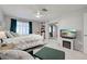 Inviting bedroom with a decorative bed, lounge seating, and entertainment area at 470 Leach St, Englewood, FL 34223