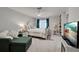 Comfortable bedroom featuring a decorative bed frame, soft carpet, and calming decor at 470 Leach St, Englewood, FL 34223